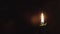 Religion, Christianity, Orthodoxy, holidays, cult concept - One single burning green candle against background of icon