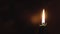 Religion, Christianity, Orthodoxy, holidays, cult concept - One single burning green candle against background of icon