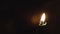 Religion, Christianity, Orthodoxy, holidays, cult concept - One single burning green candle against background of icon