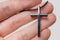 Religion concept. Metallic cross in man\'s hand