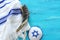 Religion image of shofar horn on white prayer talit. Rosh hashanah jewish New Year holiday, Shabbat and Yom kippur concept