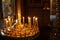 Religion and magic. Candles are burning in a dark church. In the background is a mysterious dim light and an old