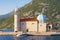 Religious architecture. Church of Our Lady of the Rocks Gospa od Skrpjela on sunny summer day. Montenegro, Bay of Kotor