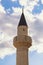 Religious architecture. Minaret of Mosque against sky. View of Sultan Ahmed Mosque in Old Town of Trebinje. Bosnia and Hercegovina