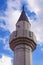 Religious architecture. Minaret of Mosque against sky. View of Sultan Ahmed Mosque. Trebinje city, Bosnia and Herzegovina