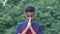 A Religious Asian Male Teen Praying