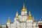 Religious building, Orthodox Christian cathedral with golden domes. Transfiguration Cathedral, Holy Dormition Pochayiv Lavra in U