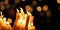 Religious candle light on black background. Yellow candlelight flame in dark christian church at night