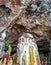 Religious carvings on limestone rock in sacred Kaw Goon cave near Hpa-An in Myanmar Burma