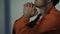 Religious Caucasian prisoner praying God in cell, asking for forgiveness, faith