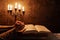 Religious female crossed hands in prayer with bible