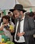 Religious Jew chooses etrog for Sukkot