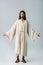 Religious man in jesus robe standing with outstretched hands