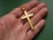 Religious metal symbol medallion in hand