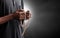 Religious muslim man praying with rosary beads