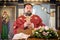 Religious priest holds holy Christian cross during religious chuch ceremony