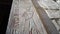 Remaining blue painting on relief hieroglyphics at chamber entrance column Temple of Hatshepsut