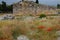 remains of the ancient antique buildings of Hierapolis from limestone blocks, dilapidated walls