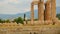 Remains of ancient Olympian Zeus Temple corner, modern Athens in background