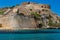 Remains of the ancient Venetian fortress of Spinalonga overlooking the calm, warm, clear waters of the Aegean Sea