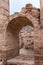 The remains of the arched passage between the halls in remains of Roman Temple in Petra. Near Wadi Musa city in Jordan