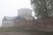Remains of the Church of the Assumption of the Blessed Virgin with the hospital ward Trinity-Gleden of the monastery misty on a su