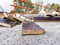 Remains of debris thrown on a site with nails that pose a danger to workers