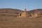 Remains of a derelict homestead in outback landscape