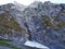 The remains of glacier under the top of Glarnisch by Lake Klontalersee