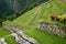 Remains of Inca Agricultural Terraces on the Mountain Slope of Machu Picchu Citadel, Sacred Valley of the Inca in Cuzco, Peru