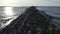 Remains of metal structures on an old abandoned, decaying sea pier