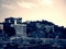 Remains of the old Forum in Rome, Italy in black and white; dramatic, retro style