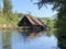 Remains of an old sawmill on the small dam of ÄŒogrljevo Lake in the mountain hamlet of TiÄ‡i - Gorski kotar, Croatia