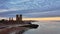 Remains of Reculver church towers at early October sunrise  early october