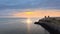 Remains of Reculver church towers at early October sunrise  early october