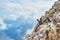 Remains of a steel rock anchor and an old climbing piton on via ferrata Eterna route, in Dolomites mountains, Italy