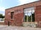 Remains of Tornado Destroyed Building Now Serve as Giant Window and Perch for Single Bird