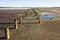 The remains of water on the dried estuary, where salt was mined in the 20th century.