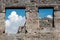 Remains of windows in antique wall in Pompeii. Pompeii was destroyed and buried with ash and pumice after Vesuvius eruption in