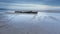 The remains of the wreck of the Hanseat, on Warkworth Beach on the coast of Northumberland.