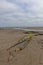 The remains of a wreck on Montrose Beach with its metal hull plates exposed by the low tide