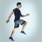 Remember your limits as you set your mark. Studio shot of an athletic young man running against a grey background.