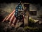 Remembering Our Fallen Heroes. A grave with a cross in front of an American flag