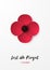 Remembrance day vertical banner with red Poppy flower and inscription Lest we forget.