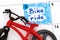 Reminder bike ride in calendar with red bicycle toy.