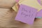 a reminder - don't forget written on color sticker notes on wooden background