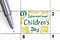 Reminder International Children`s Day in calendar with pen