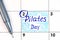 Reminder Pilates Day in calendar with pen