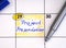 Reminder Project Presentation in the calendar with a blue pen