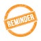 REMINDER text on orange grungy round stamp